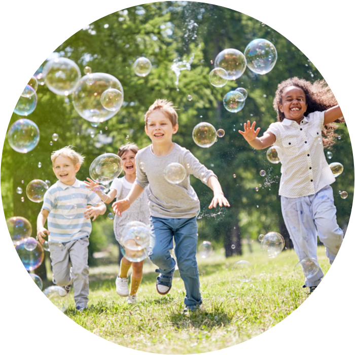 Kids running with bubbles