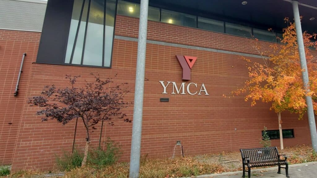Exterior of the Centre for Life building with the YMCA logo